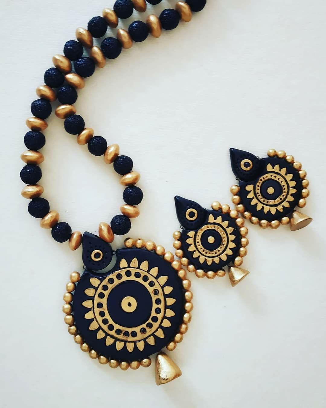 Black and gold terracotta set with earrings